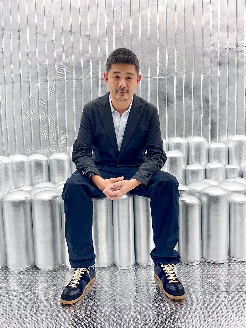 Aric Chen takes a seat on Elevator seating by Harry Nuriev, Design Miami Basel, 2021, © Karin Bürki. Explore more on Heartbrut.com